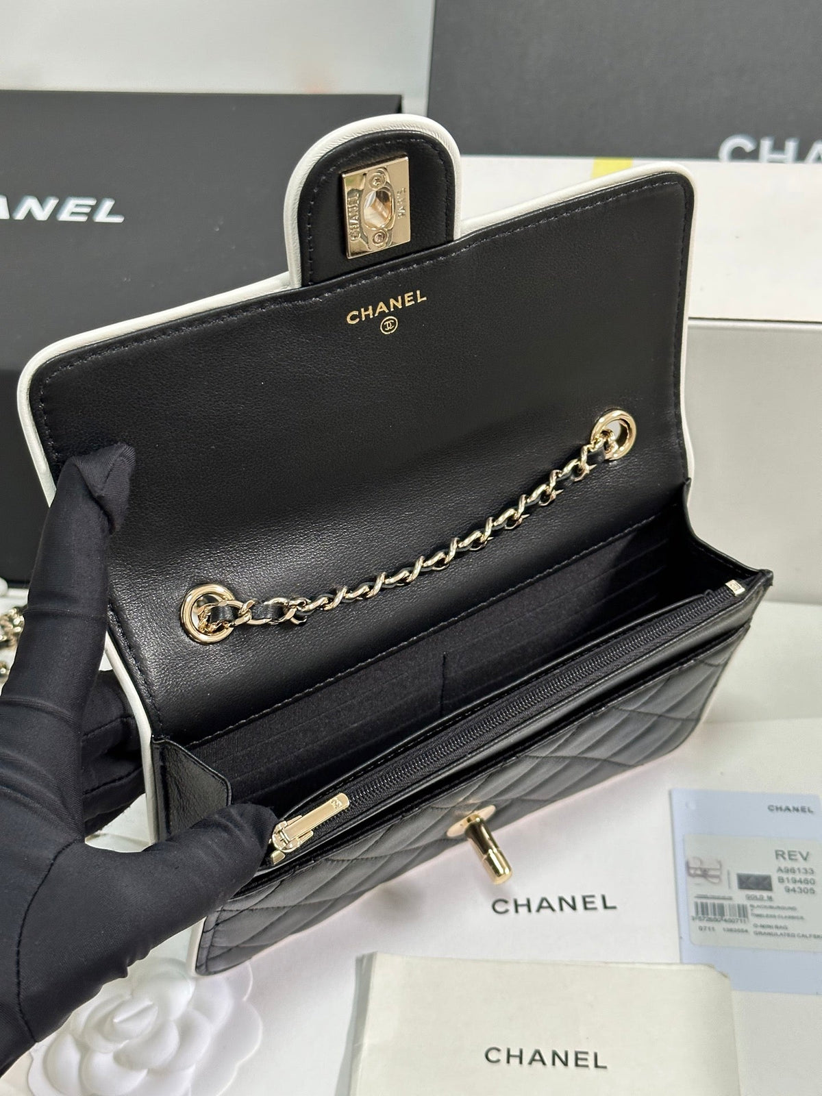 CHANEL QUILTED FLAP BAG WITH WHITE TRIM 19 IN BLACK LAMBSKIN